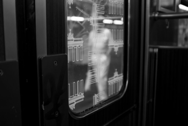 Black and white photo street photography old man train