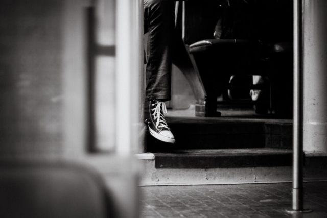 Black and white photo street photography Paris train sneaker